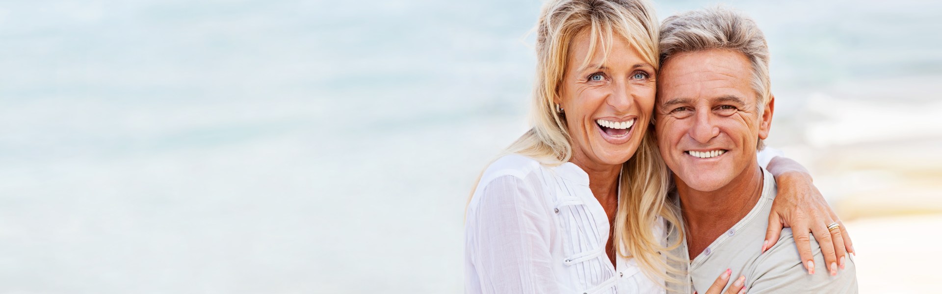 couple on beach smiling